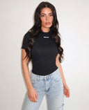 UNIQUE THE LABEL JACKY KURZARM-TOP – SCHWARZ